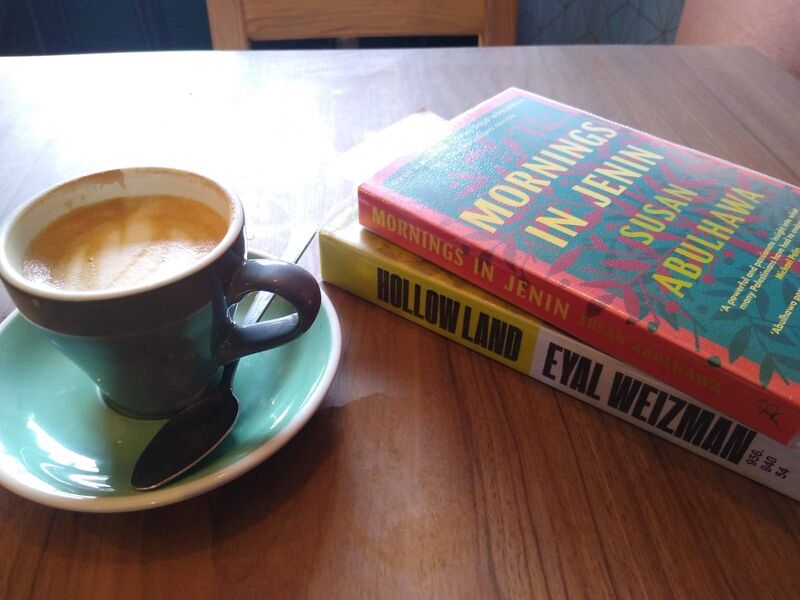 Mornings in Jenin, Hollow Land and a coffee on a table